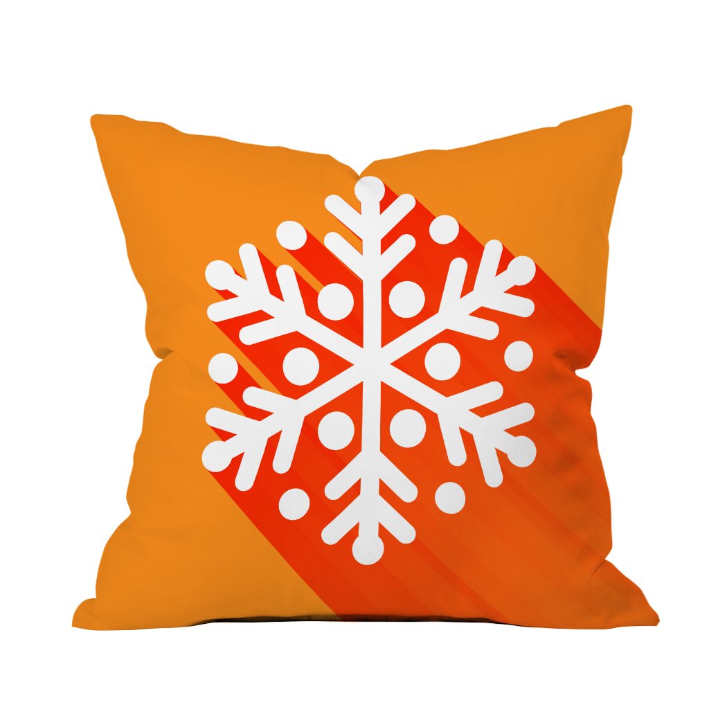 A decorative pillow featuring a vibrant orange snowflake design on a soft fabric background.

