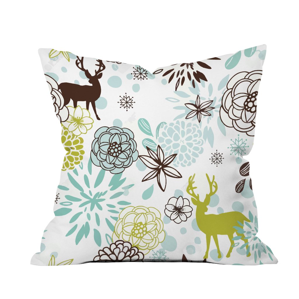 A decorative pillow featuring a deer surrounded by colorful flowers, adding a touch of nature to home decor.

