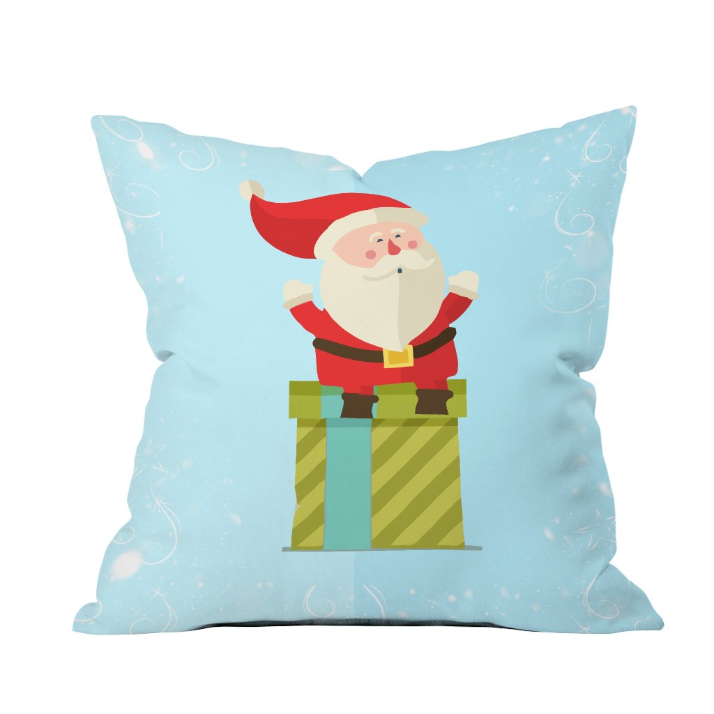 A cozy pillow featuring a cheerful Santa Claus resting on top, perfect for holiday decor.

