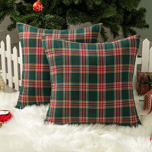 Two cozy pillows featuring stylish plaid designs, adding a touch of warmth to any space.