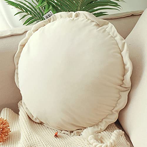 A round pillow adorned with white ruffles, adding a touch of elegance and charm to any space.