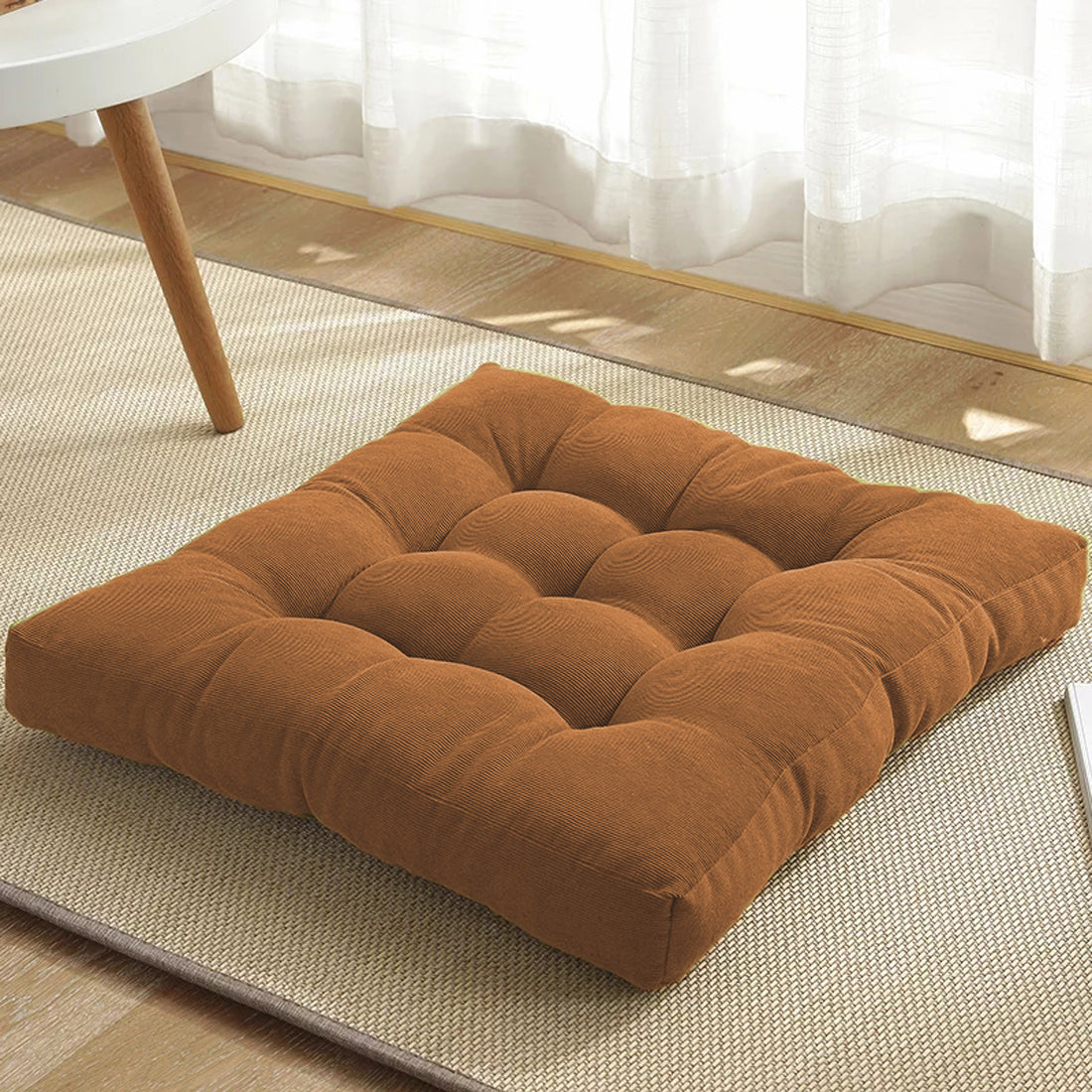  Brown square cushion on rug