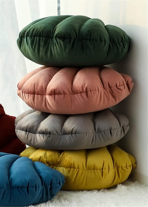  Colorful stack of pillows in various hues, perfect for adding a pop of color to any room decor.