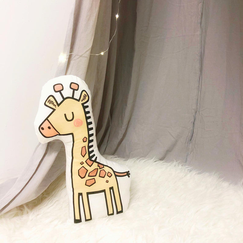  Giraffe pillow on white rug, perfect for adding a touch of whimsy to your living room decor.