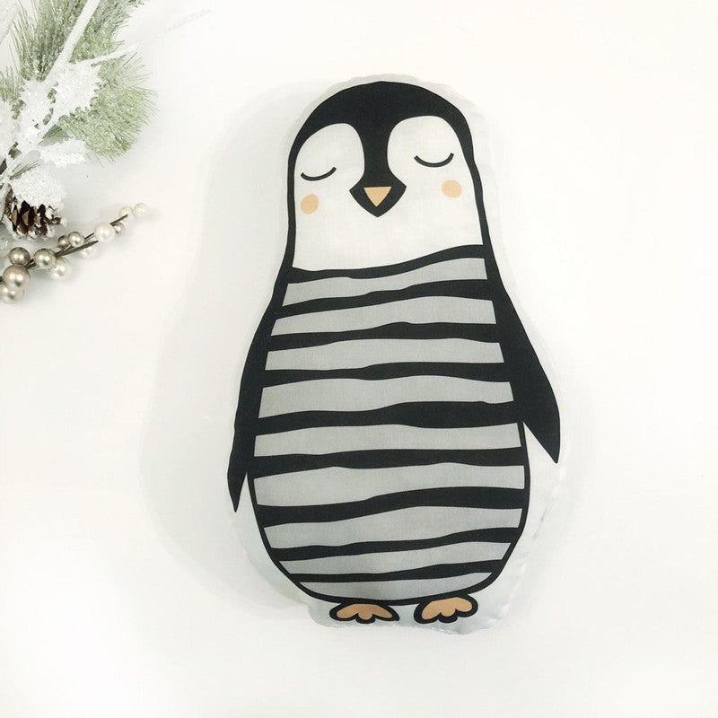 A cute penguin pillow with black and white stripes.