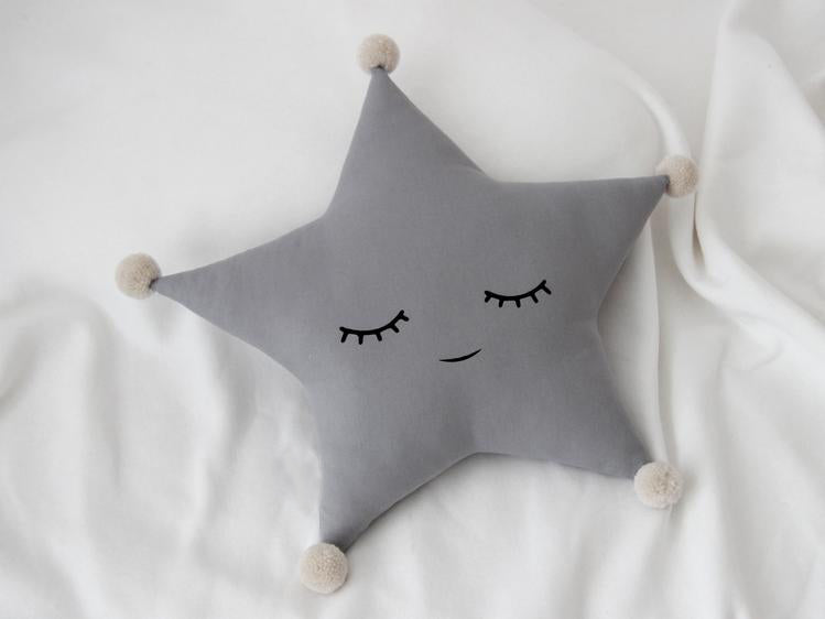 star pillow with adorable yellow eyes, perfect for snuggling and adding a pop of color to any room!