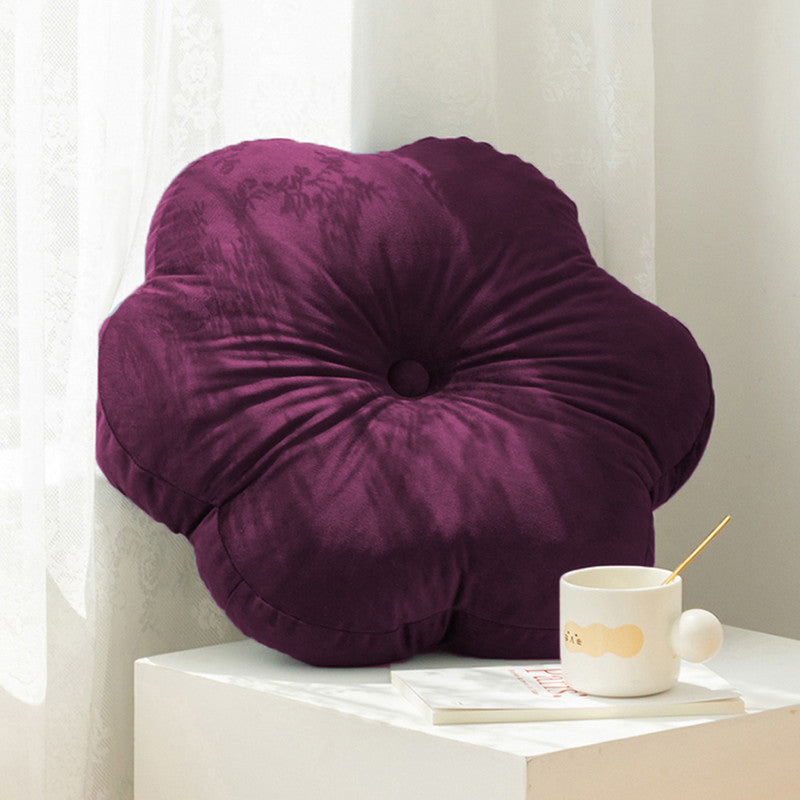  flower cushion on white table, adding a pop of color to your decor.