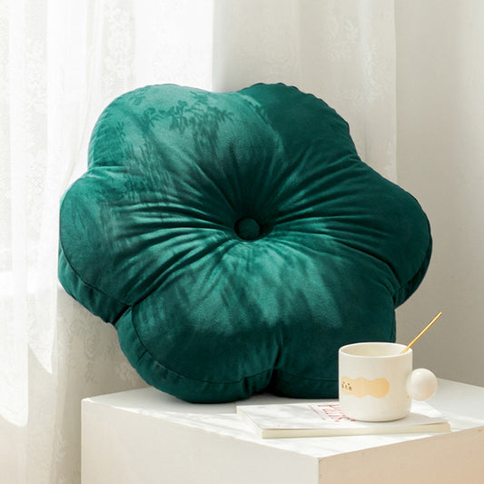  flower cushion on white table, adding a pop of color to your decor.