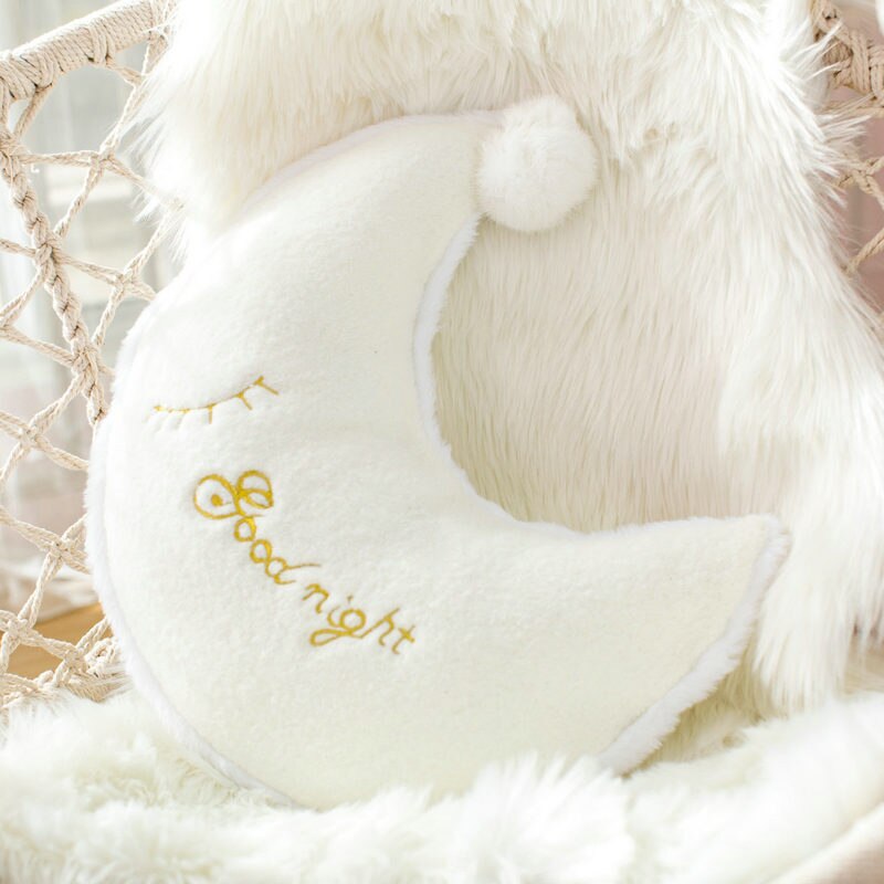 A white pillow with "Good Night" written on it, perfect for a cozy sleep.