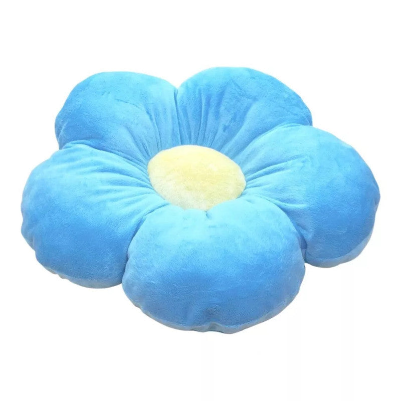 A cozy blue flower pillow with a sunny yellow center, perfect for adding a touch of nature to your home decor.