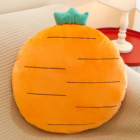 A cozy carrot-shaped pillow in orange color resting on a bed.