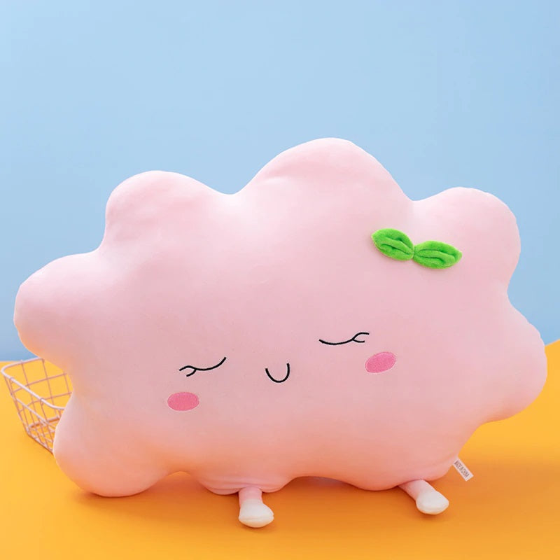 2. Cute pink cloud pillow adorned with a green bow, a charming addition to any cozy space.