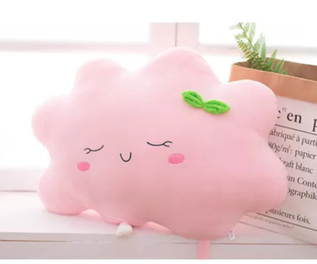 3. Add a pop of color to your room with this pink cloud pillow featuring a sweet green bow.