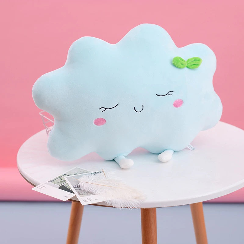 1. Blue cloud pillow on table, perfect for adding a touch of whimsy to your home decor.