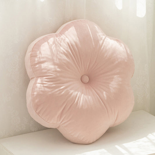  Flower cushion on white table, adding a pop of color to your decor.