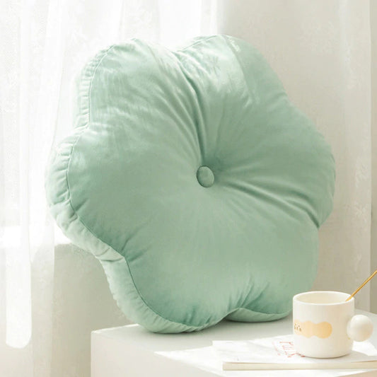  flower cushion on white table, adding a pop of color to your decor.