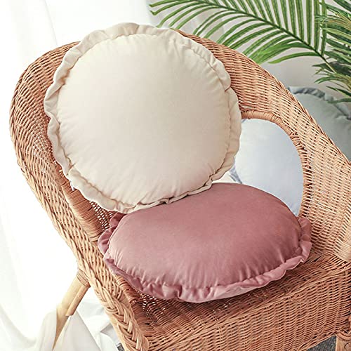 Vibrant round pillows on bedspread.