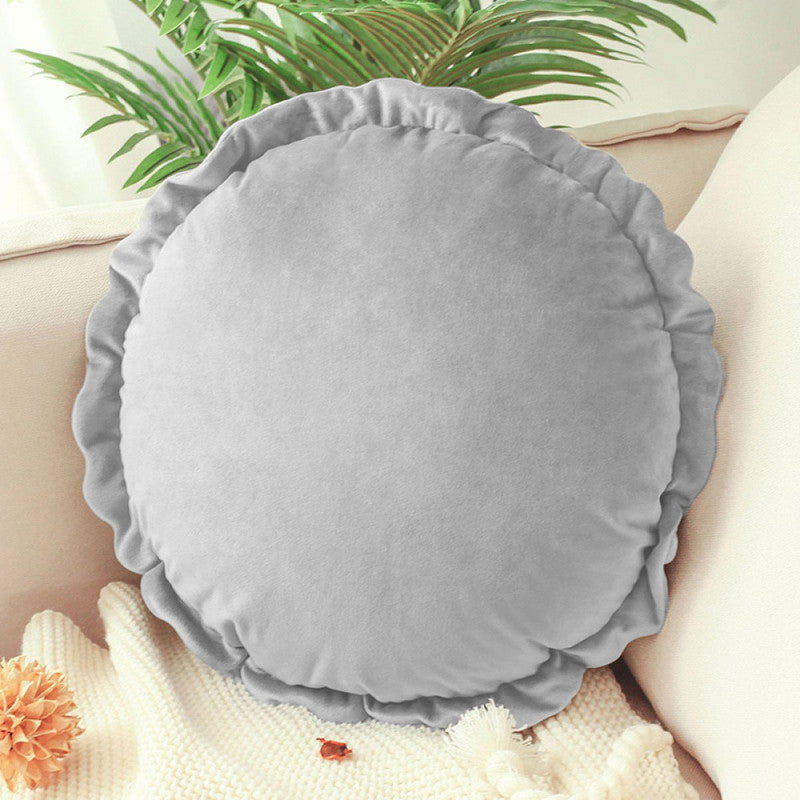 A round pillow with a white pillow case, providing comfort and support for a good night's sleep.