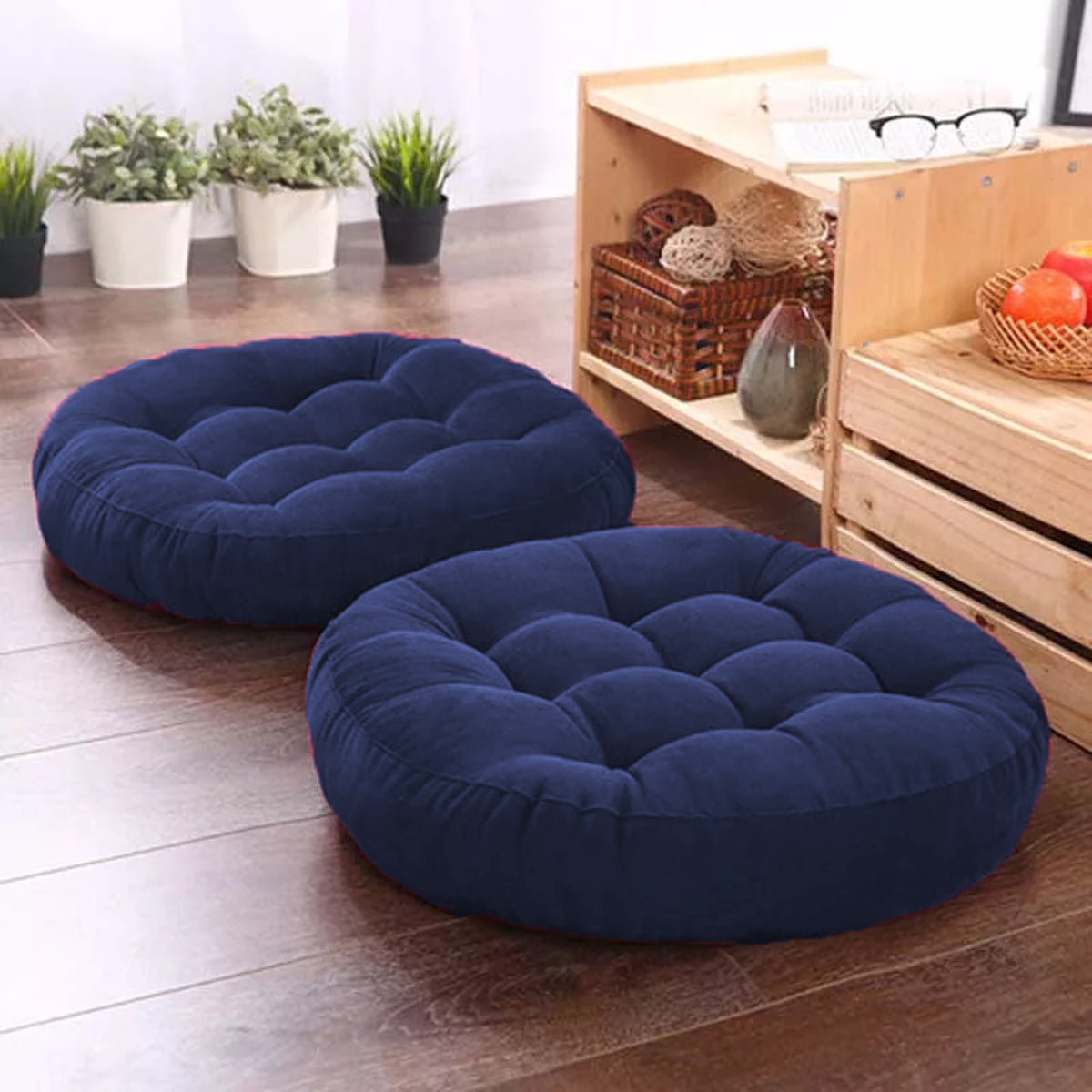  Pair of round blue cushions on floor