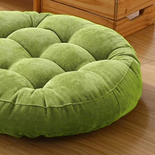 Green circular cushions on wood floor.