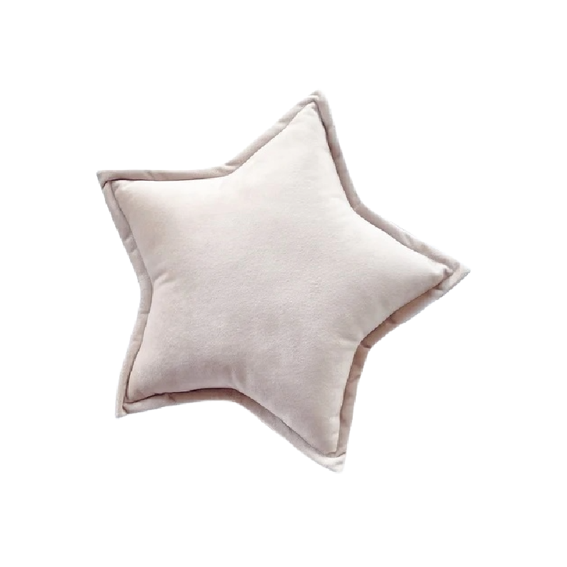 White pillow with star design, perfect for adding a touch of whimsy to your bedroom decor.