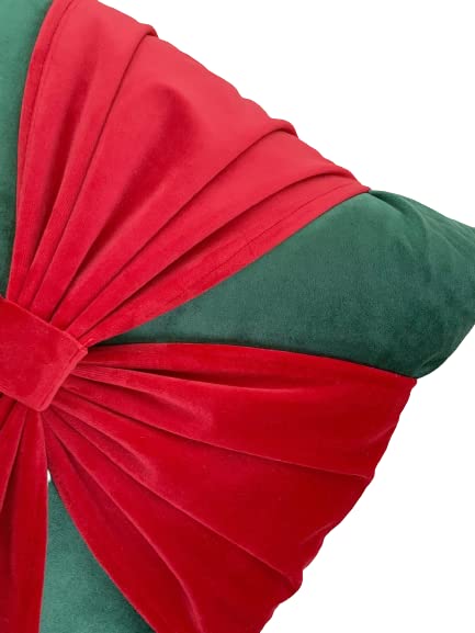  Add a splash of color to your space with this green and red pillow featuring a charming red bow.