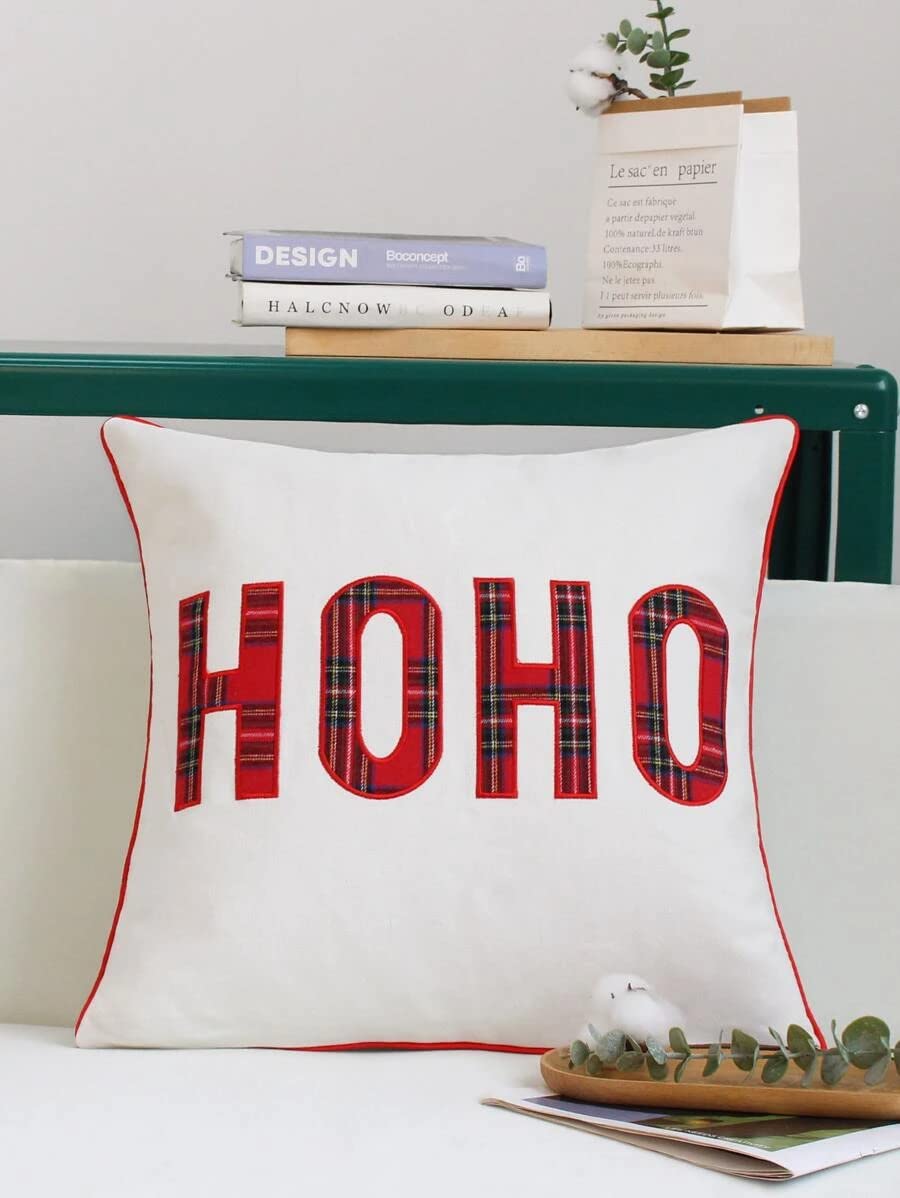 A chair with a pillow displaying the word "hoh" on it.