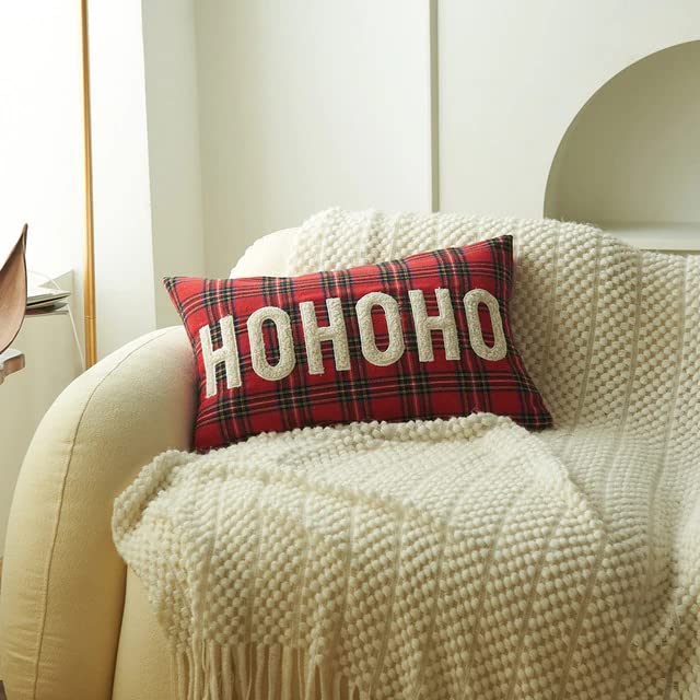 Festive red pillow with 'ho ho ho' text in white, perfect for holiday decor.