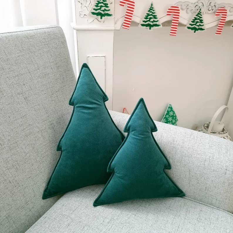 1. Two green Christmas trees on a couch.