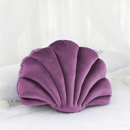  pillow with a shell shape, adding a touch of elegance and comfort to any space.