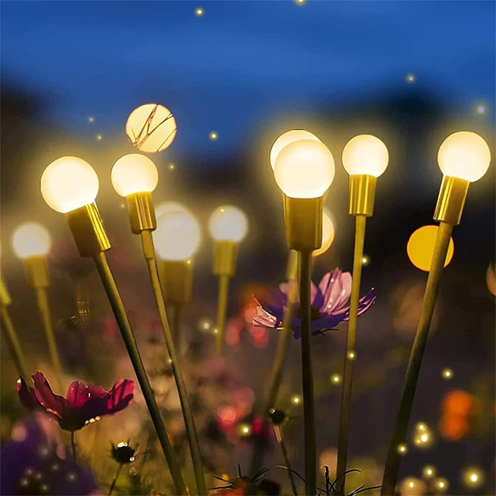 Twinkling lights adding charm to a beautiful garden scene.