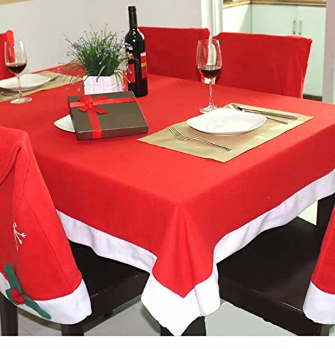 Christmas-themed table setting with red and white tablecloths for a festive atmosphere.