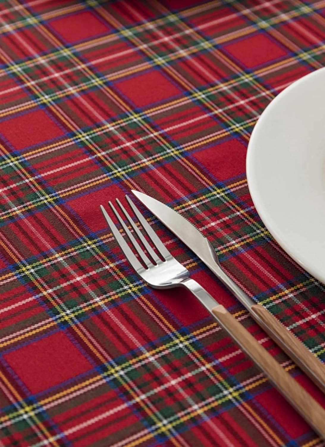  Dining table topped with red and black plaid cloth