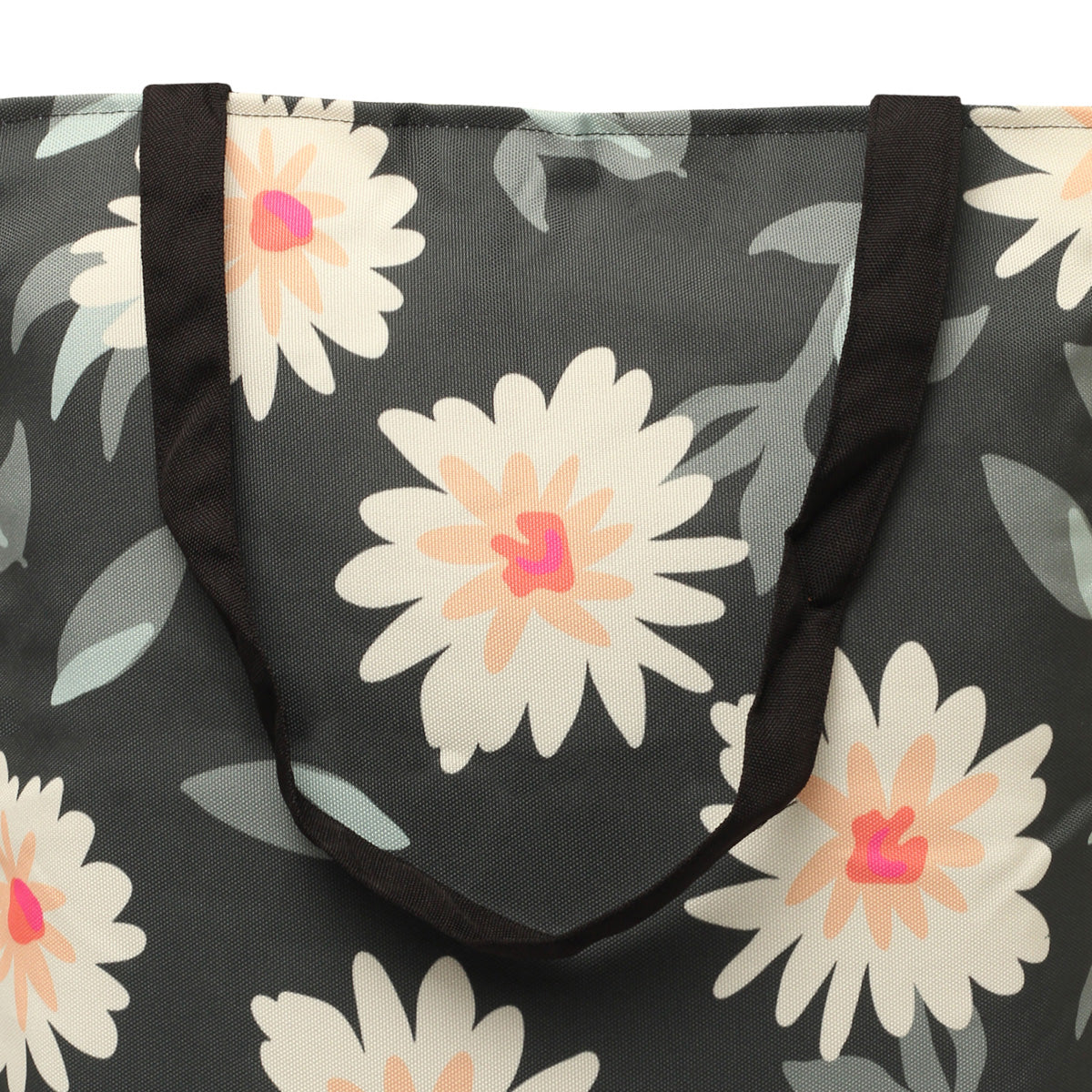 A tote bag with a black and white floral pattern, perfect for adding a touch of elegance to any outfit.