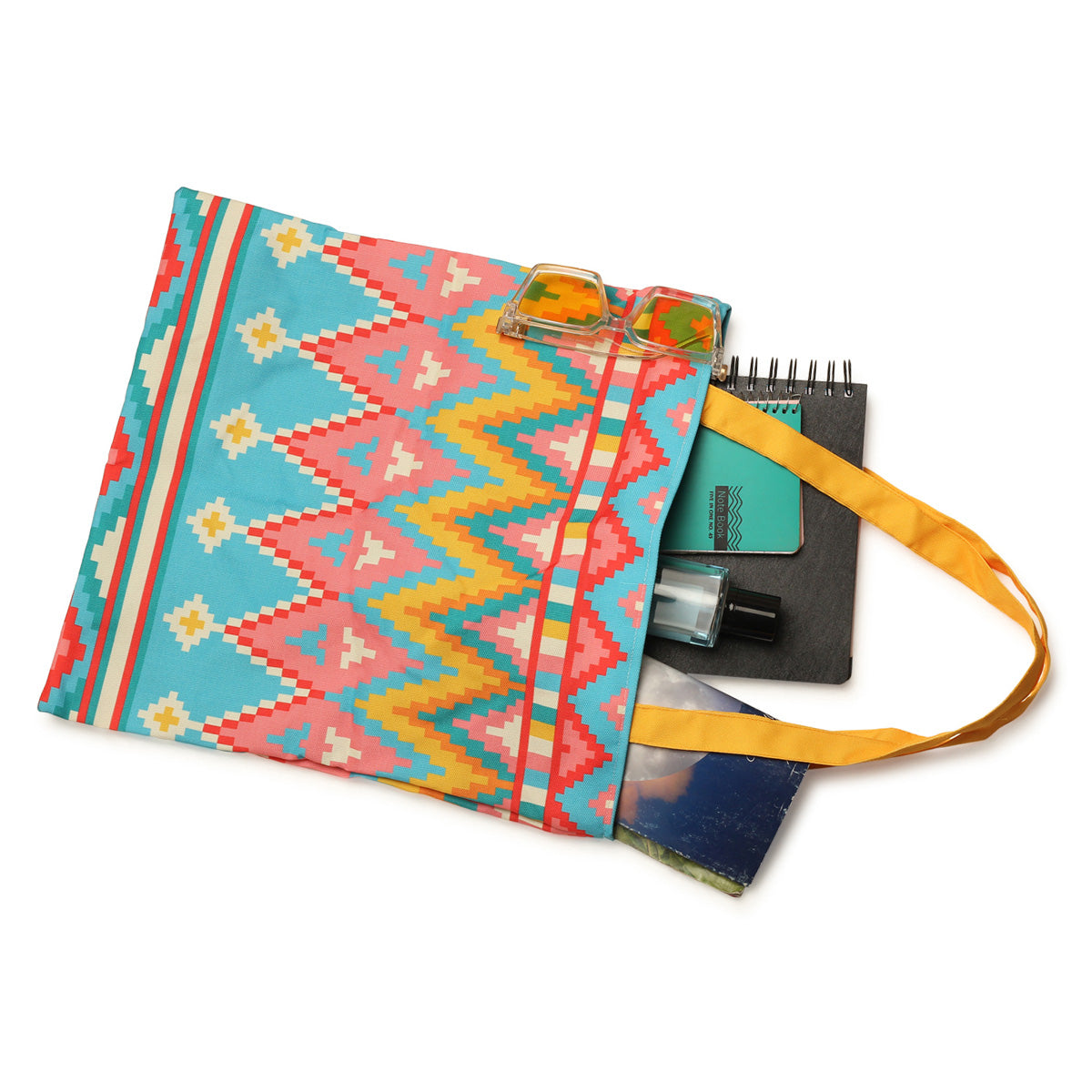 Eye-catching tote bag adorned with a colorful geometric pattern, a chic accessory for any occasion.