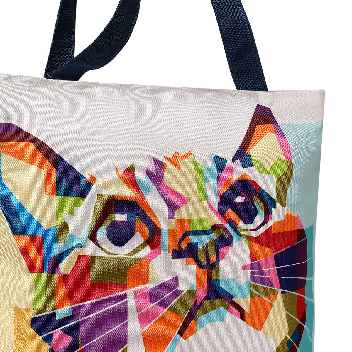 A vibrant tote bag featuring a cat face design, bursting with colors. Perfect for cat lovers and adding a touch of fun to any outfit.