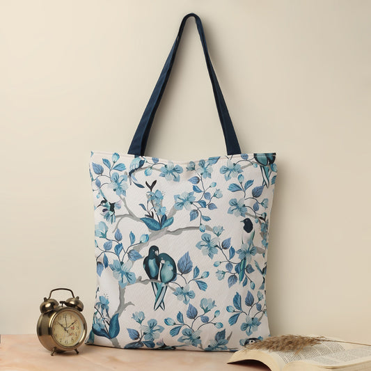 Blue and white floral tote bag with clock and books, perfect for a stylish and organized day out.