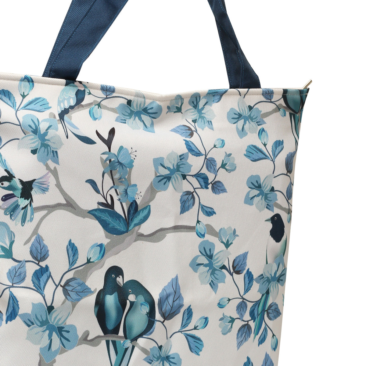 A stylish tote bag with blue and white colors, adorned with charming bird designs.