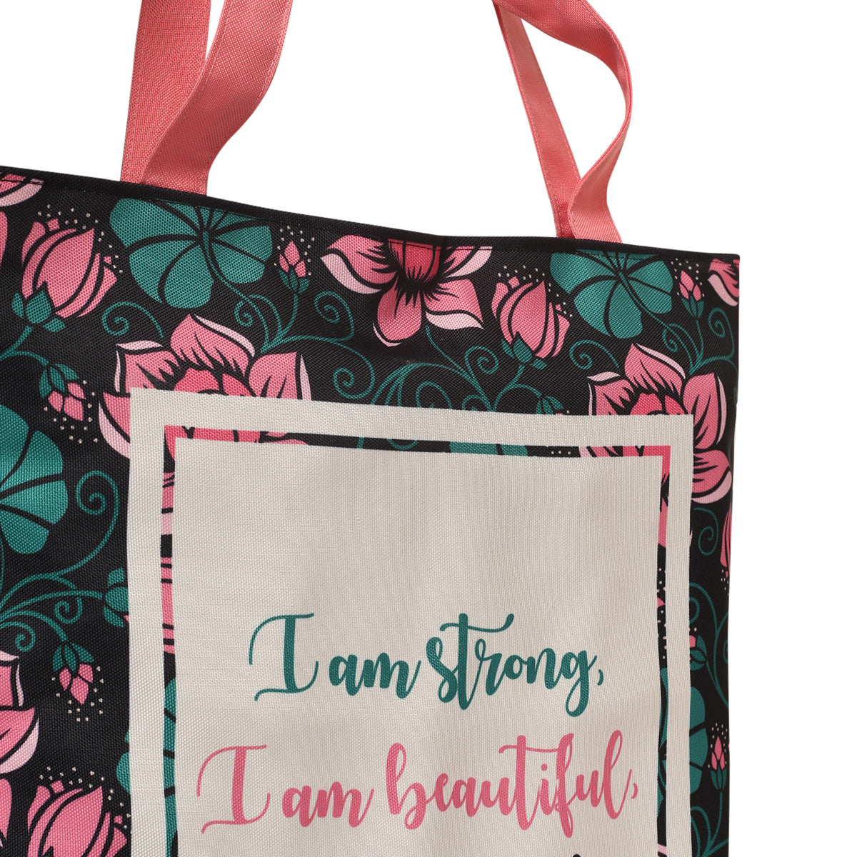 A tote bag with the quote "I am strong, I am beautiful, I am strong" on it.