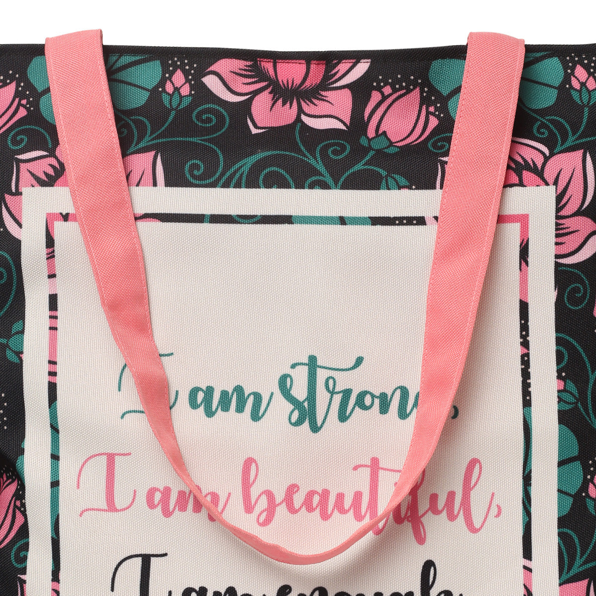 A tote bag with the quote "I am strong, I am beautiful, I am strong" on it.