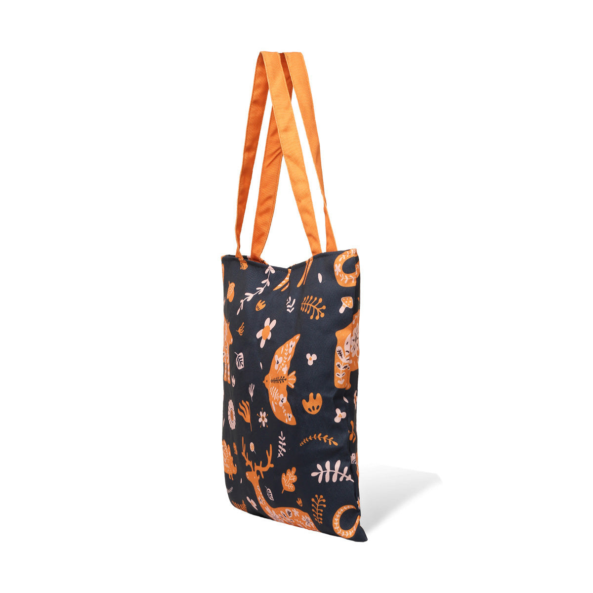 Side view of  A black tote bag with orange and white animal and plant print designs, featuring deer, fish, and flowers, with orange handles.