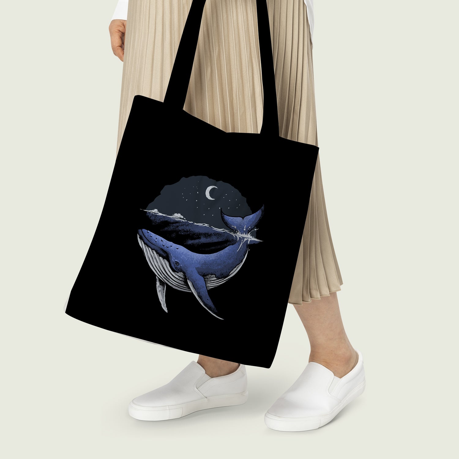 Fashionable tote bag showcasing a whale design alongside moon and stars, a unique accessory for any occasion