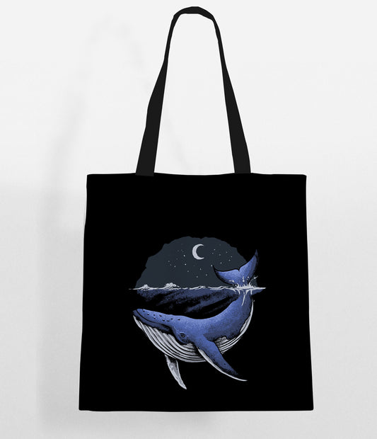 Whale tote bag featuring moon and stars design, perfect for carrying essentials with a celestial touch.