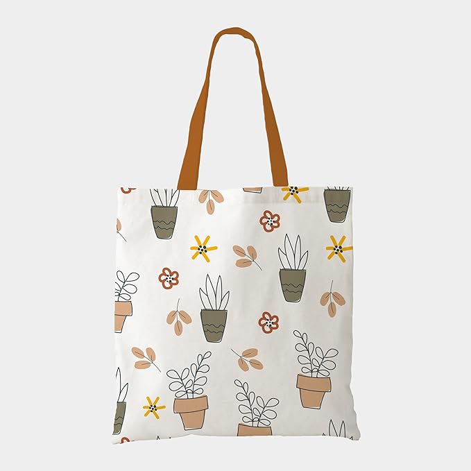 A stylish tote bag adorned with various plants and vibrant flowers, perfect for eco-friendly shopping or daily use.

