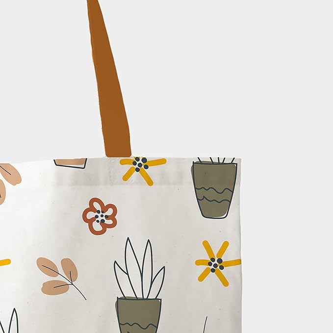 A charming tote bag embellished with a variety of plants and flowers, suitable for carrying essentials with a floral flair.