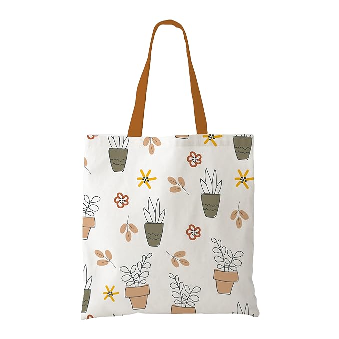 . A tote bag showcasing an elegant pattern of plants and flowers, combining functionality with a touch of natural beauty.