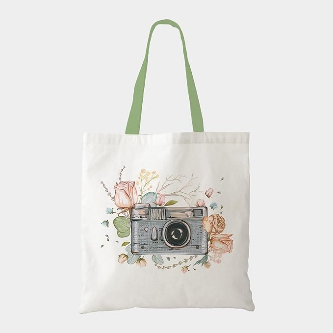 A trendy tote bag adorned with a colorful image of a camera, ideal for carrying your essentials in style.