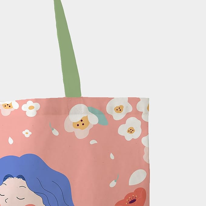 A charming tote bag displaying a cartoon girl amidst colorful flowers, perfect for shopping or casual outings.