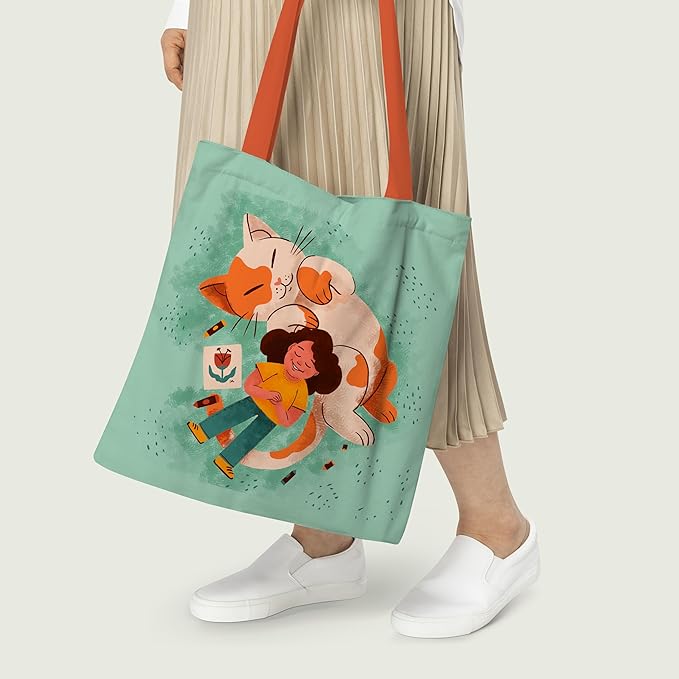 A charming tote bag adorned with a girl and her cat, combining functionality with a touch of whimsy.
