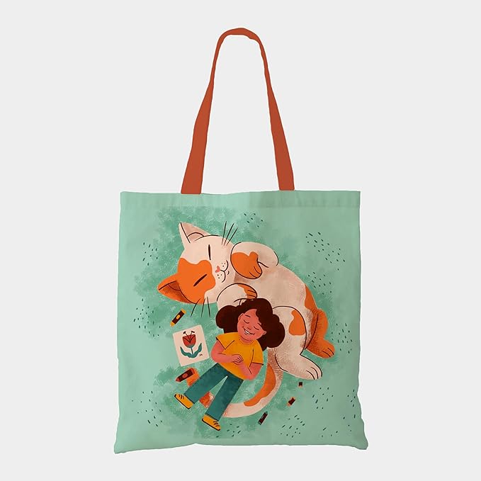  A stylish tote bag showcasing a girl and her adorable cat, ideal for everyday use and cat lovers alike.
